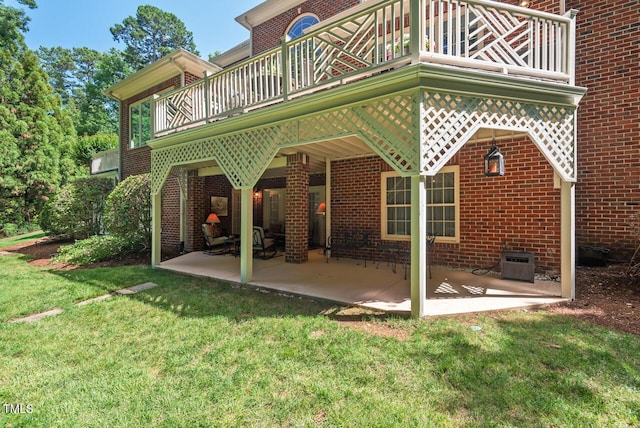 3606 Dairy Pond Pl, Durham, NC 27705 - back of house featuring a yard, brick siding, a patio, and a balcony