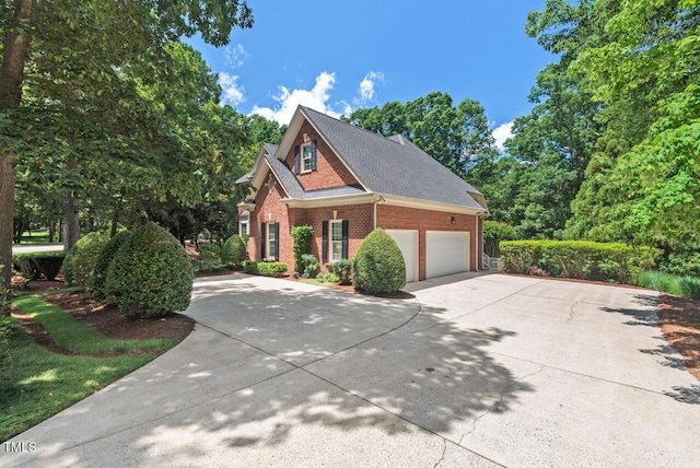 3606 Dairy Pond Pl, Durham, NC 27705 - view of front facade featuring brick siding, driveway, a garage, and roof with shingles