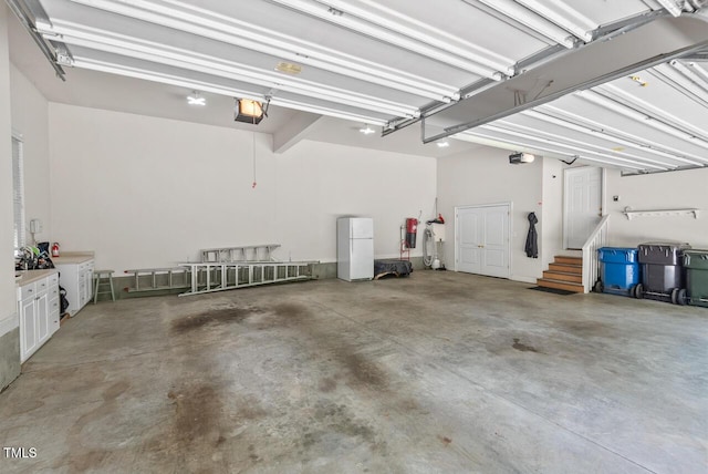 3606 Dairy Pond Pl, Durham, NC 27705 - garage with a garage door opener and freestanding refrigerator