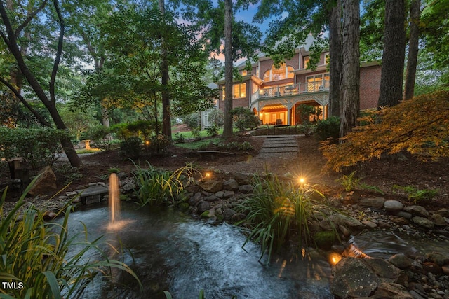 3606 Dairy Pond Pl, Durham, NC 27705 - view of front of home featuring a balcony and a small pond