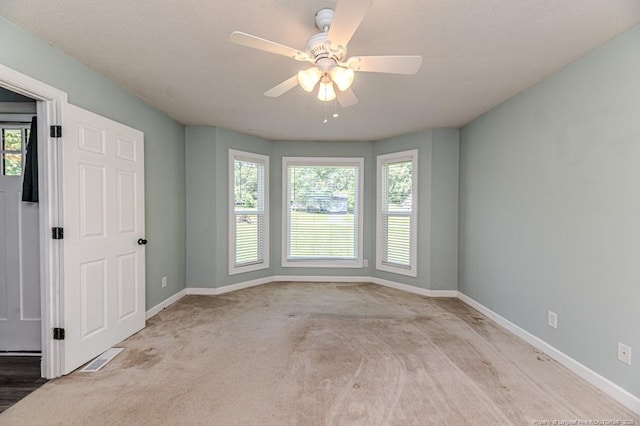 4101 Carson Dr, Sanford, NC 27332 - empty room featuring healthy amount of natural light, carpet flooring, and a ceiling fan