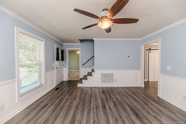 4101 Carson Dr, Sanford, NC 27332 - unfurnished room featuring a ceiling fan, wainscoting, stairway, wood finished floors, and a textured ceiling