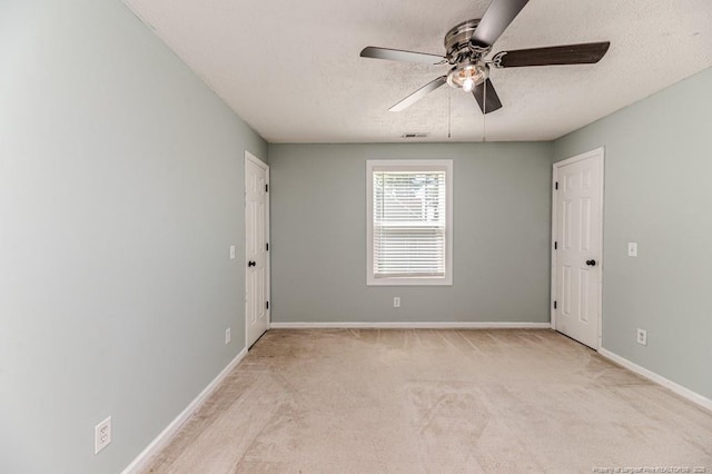 4101 Carson Dr, Sanford, NC 27332 - spare room featuring ceiling fan, a textured ceiling, and carpet