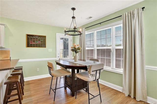 167 Westminster Dr, Raeford, NC 28376 - dining room featuring a chandelier and light wood-type flooring