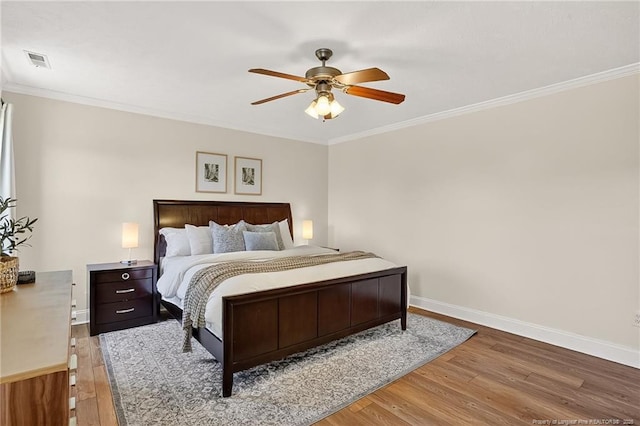 167 Westminster Dr, Raeford, NC 28376 - bedroom featuring wood finished floors, ornamental molding, and a ceiling fan