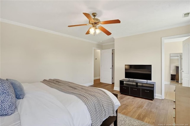167 Westminster Dr, Raeford, NC 28376 - bedroom featuring ornamental molding, light wood-type flooring, and a ceiling fan