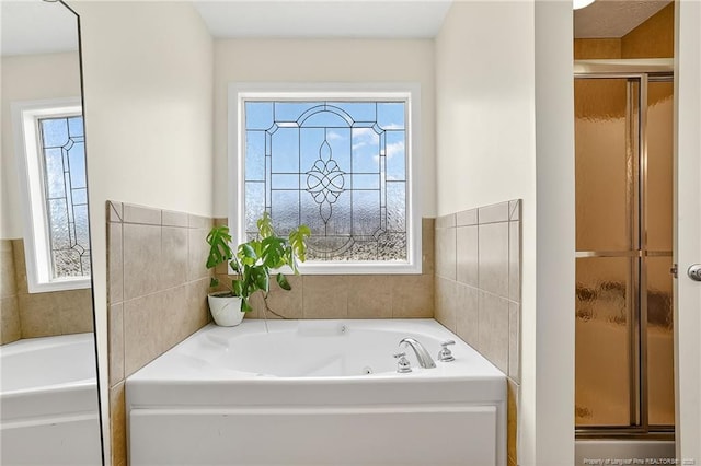 167 Westminster Dr, Raeford, NC 28376 - full bathroom featuring healthy amount of natural light, a bath, and a shower stall