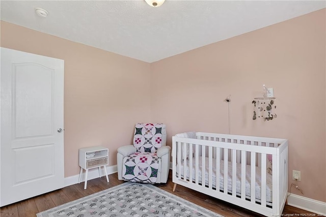 167 Westminster Dr, Raeford, NC 28376 - bedroom with wood finished floors and baseboards