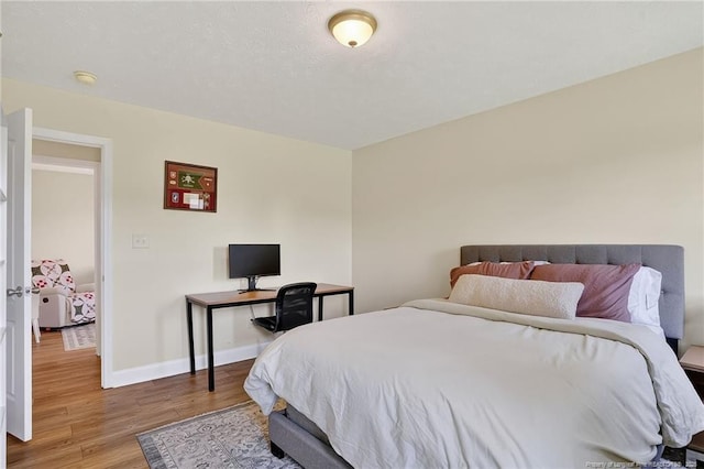167 Westminster Dr, Raeford, NC 28376 - bedroom with wood finished floors and baseboards