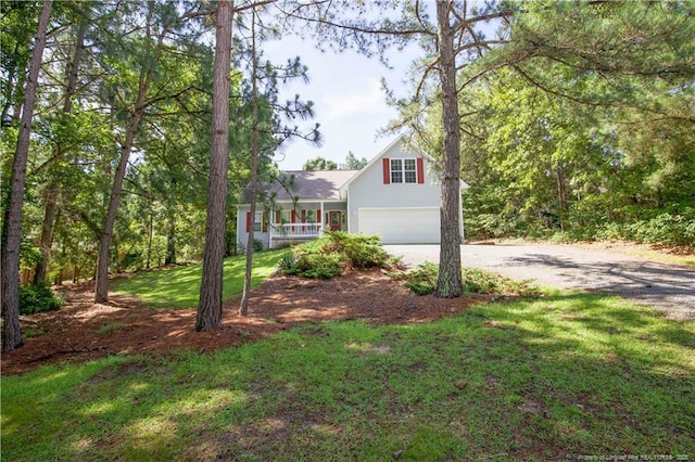 130 Pinecone Ct, Seven Lakes, NC 27376 - view of front of property featuring an attached garage, gravel driveway, and a front lawn