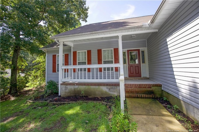 130 Pinecone Ct, Seven Lakes, NC 27376 - doorway to property featuring a porch and a shingled roof