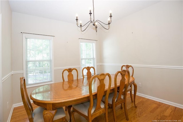 130 Pinecone Ct, Seven Lakes, NC 27376 - dining space with a chandelier and light wood-type flooring