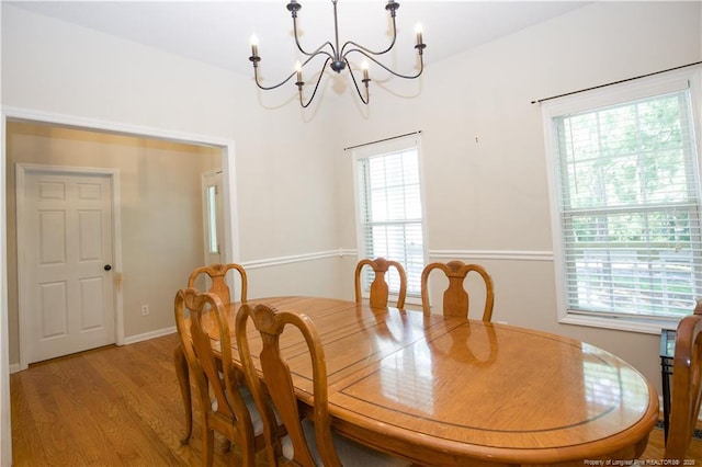 130 Pinecone Ct, Seven Lakes, NC 27376 - dining room with a chandelier, plenty of natural light, and wood finished floors