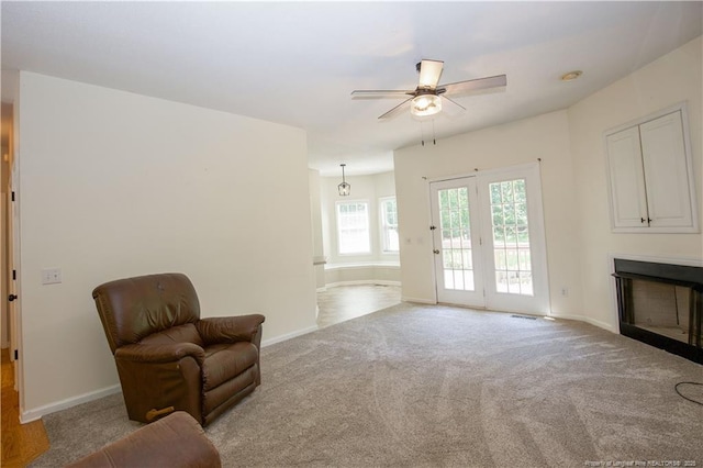 130 Pinecone Ct, Seven Lakes, NC 27376 - sitting room with ceiling fan, a fireplace, and carpet flooring