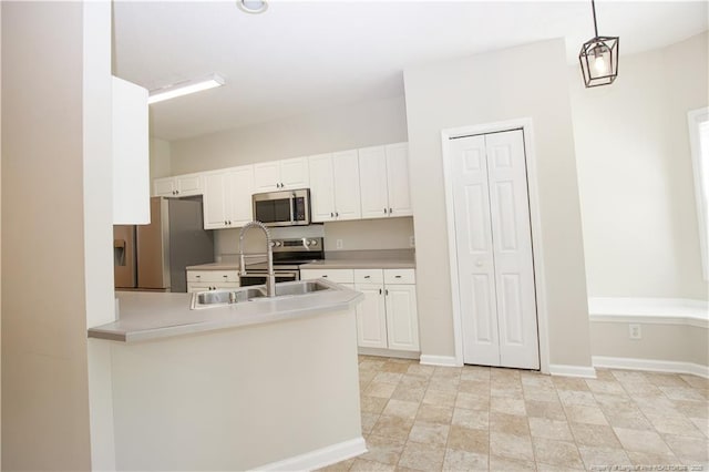 130 Pinecone Ct, Seven Lakes, NC 27376 - kitchen featuring stainless steel appliances, white cabinetry, and light countertops