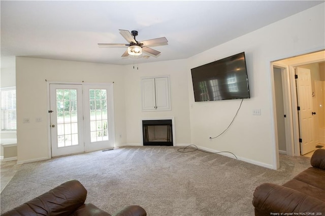 130 Pinecone Ct, Seven Lakes, NC 27376 - living area with a ceiling fan, light colored carpet, and a fireplace