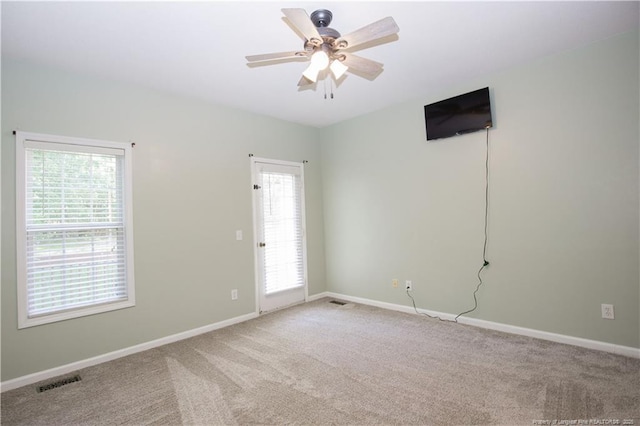 130 Pinecone Ct, Seven Lakes, NC 27376 - empty room featuring light carpet, healthy amount of natural light, and a ceiling fan