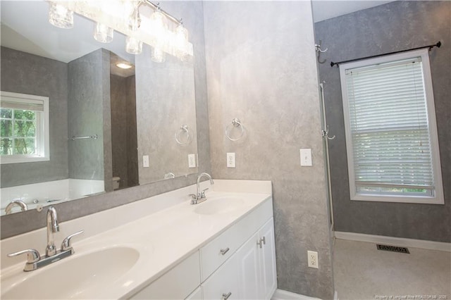 130 Pinecone Ct, Seven Lakes, NC 27376 - bathroom with double vanity and baseboards