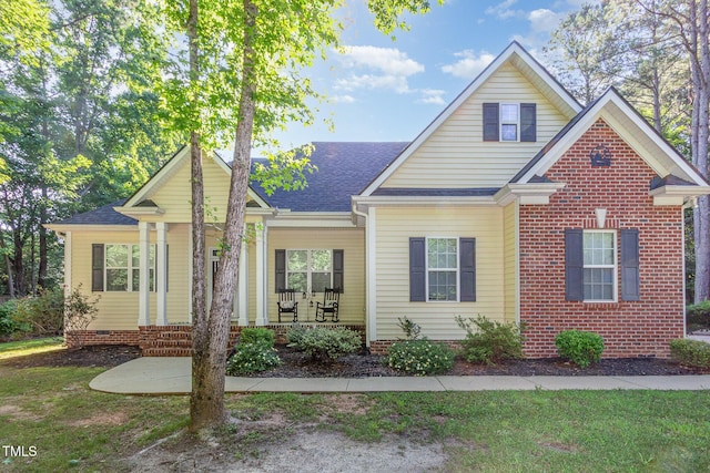 15 Cole Creek Way, Franklinton, NC 27525 - traditional-style house featuring covered porch, roof with shingles, and a front yard