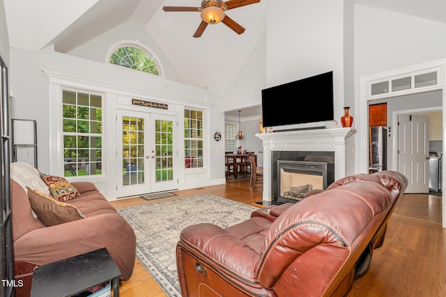 15 Cole Creek Way, Franklinton, NC 27525 - living area featuring ceiling fan, high vaulted ceiling, french doors, a tile fireplace, and wood finished floors