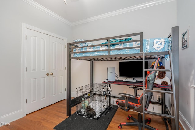 15 Cole Creek Way, Franklinton, NC 27525 - bedroom featuring ornamental molding, wood finished floors, a desk, and a closet