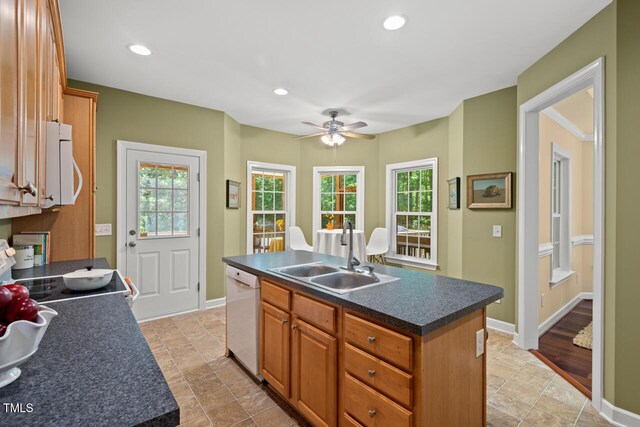 126 Captains Ct, Durham, NC 27712 - kitchen with white appliances, dark countertops, plenty of natural light, a ceiling fan, and recessed lighting