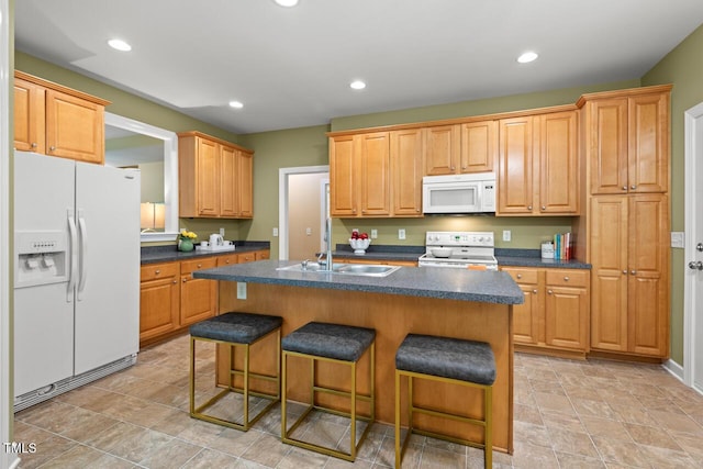 126 Captains Ct, Durham, NC 27712 - kitchen featuring white appliances, dark countertops, a kitchen breakfast bar, a kitchen island with sink, and recessed lighting