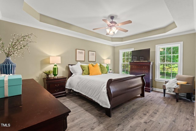 126 Captains Ct, Durham, NC 27712 - bedroom with a tray ceiling, wood finished floors, ornamental molding, and a ceiling fan