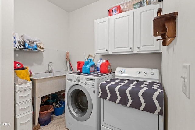 126 Captains Ct, Durham, NC 27712 - laundry room with washer and clothes dryer, cabinet space, and light tile patterned flooring