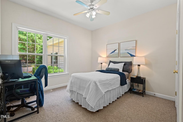 126 Captains Ct, Durham, NC 27712 - carpeted bedroom with an office area and a ceiling fan