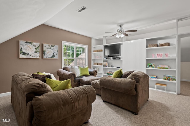 126 Captains Ct, Durham, NC 27712 - living area featuring light colored carpet, a ceiling fan, vaulted ceiling, and built in shelves