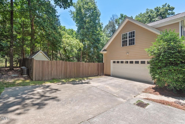 126 Captains Ct, Durham, NC 27712 - view of side of home featuring concrete driveway and a garage