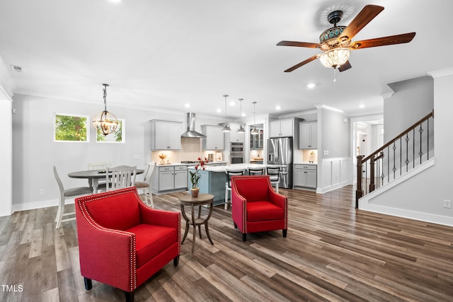 8341 Running Fern Way, Willow Springs, NC 27592 - living area featuring a ceiling fan, stairs, recessed lighting, crown molding, and dark wood-style floors