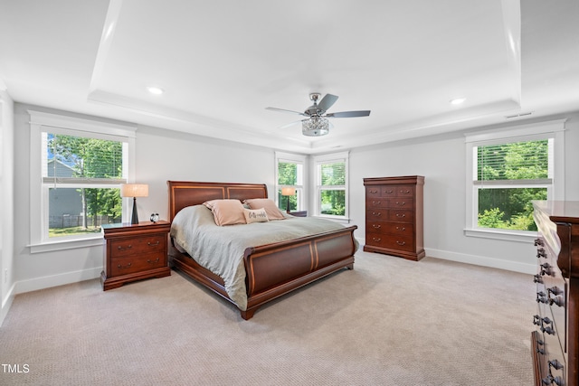 8341 Running Fern Way, Willow Springs, NC 27592 - bedroom featuring a tray ceiling, light colored carpet, recessed lighting, and ceiling fan
