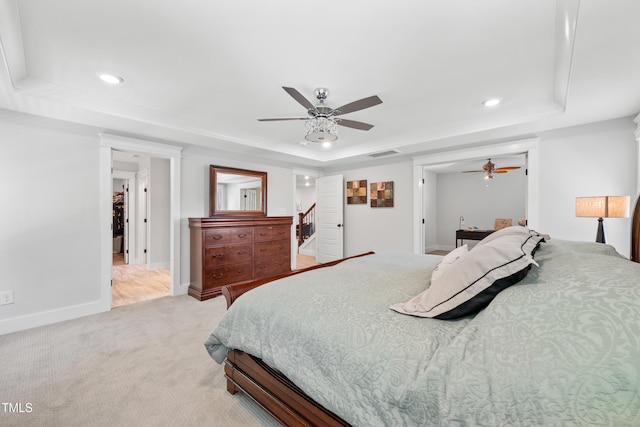 8341 Running Fern Way, Willow Springs, NC 27592 - bedroom with a tray ceiling, light carpet, recessed lighting, and ceiling fan