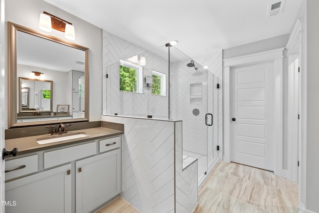 8341 Running Fern Way, Willow Springs, NC 27592 - full bath with vanity, a shower stall, and marble finish flooring