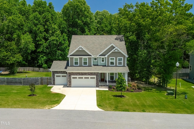 8341 Running Fern Way, Willow Springs, NC 27592 - craftsman inspired home with concrete driveway, covered porch, a garage, stone siding, and roof with shingles