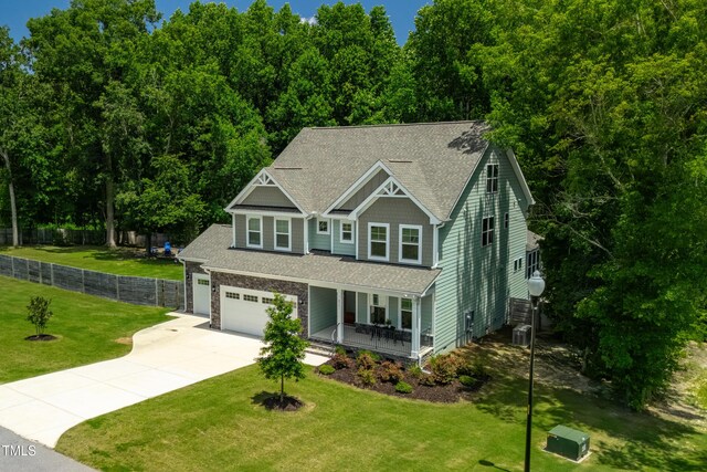 8341 Running Fern Way, Willow Springs, NC 27592 - craftsman-style house with a porch, concrete driveway, and a shingled roof