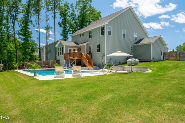 8341 Running Fern Way, Willow Springs, NC 27592 - back of property with a wooden deck, stairway, and a fenced backyard