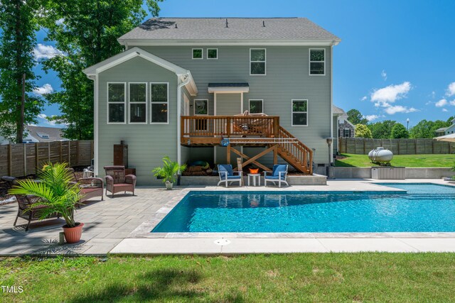8341 Running Fern Way, Willow Springs, NC 27592 - rear view of house featuring stairs, a wooden deck, a fenced backyard, and a patio
