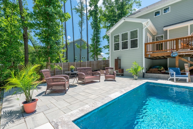 8341 Running Fern Way, Willow Springs, NC 27592 - view of swimming pool with a patio, a deck, and a fenced backyard