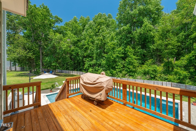 8341 Running Fern Way, Willow Springs, NC 27592 - wooden deck with a fenced backyard, grilling area, and a patio