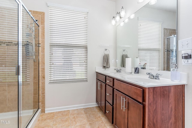 543 Callandale Ln, Durham, NC 27703 - full bath with double vanity, a stall shower, and tile patterned flooring