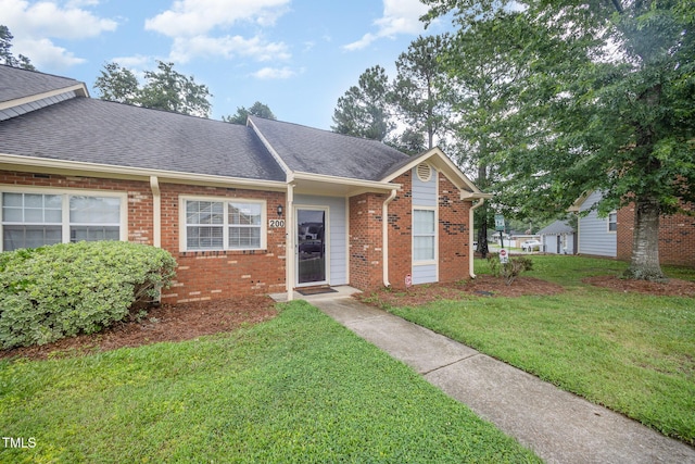 200 Old Spring Hill Ln, Fuquay Varina, NC 27526 - ranch-style home with a front lawn, brick siding, and a shingled roof
