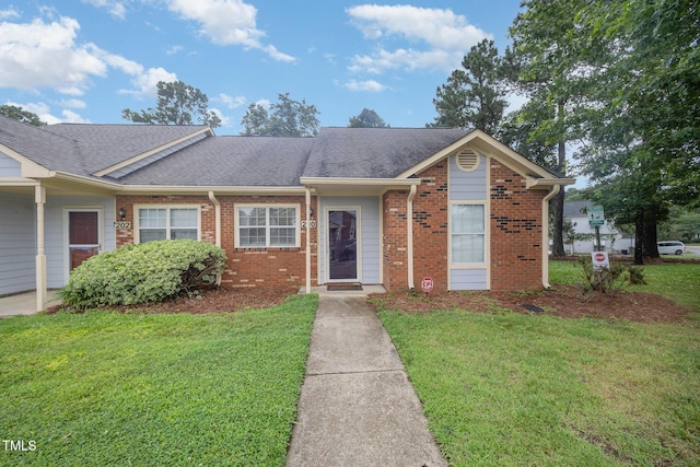 200 Old Spring Hill Ln, Fuquay Varina, NC 27526 - single story home featuring a front yard, roof with shingles, and brick siding