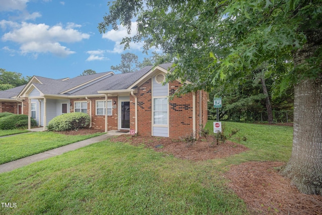 200 Old Spring Hill Ln, Fuquay Varina, NC 27526 - ranch-style house featuring a front lawn and brick siding