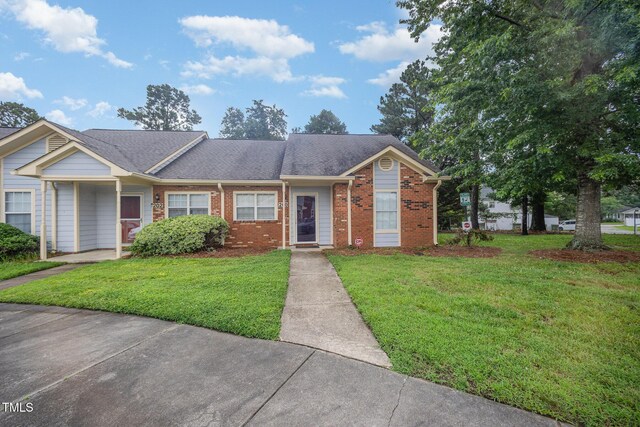 200 Old Spring Hill Ln, Fuquay Varina, NC 27526 - view of front of home featuring brick siding and a front lawn