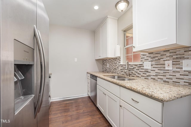 200 Old Spring Hill Ln, Fuquay Varina, NC 27526 - kitchen with appliances with stainless steel finishes, decorative backsplash, dark wood-style flooring, white cabinets, and recessed lighting
