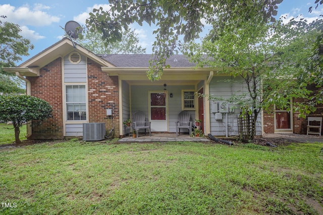 200 Old Spring Hill Ln, Fuquay Varina, NC 27526 - view of front of property featuring a front lawn, covered porch, brick siding, and roof with shingles