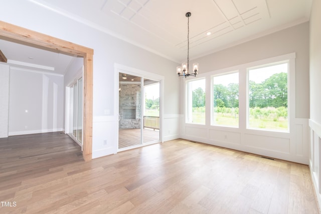 0 Bluestone Ct Lot 22R, Chapel Hill, NC 27514 - empty room with a chandelier, light wood-style floors, wainscoting, a decorative wall, and crown molding